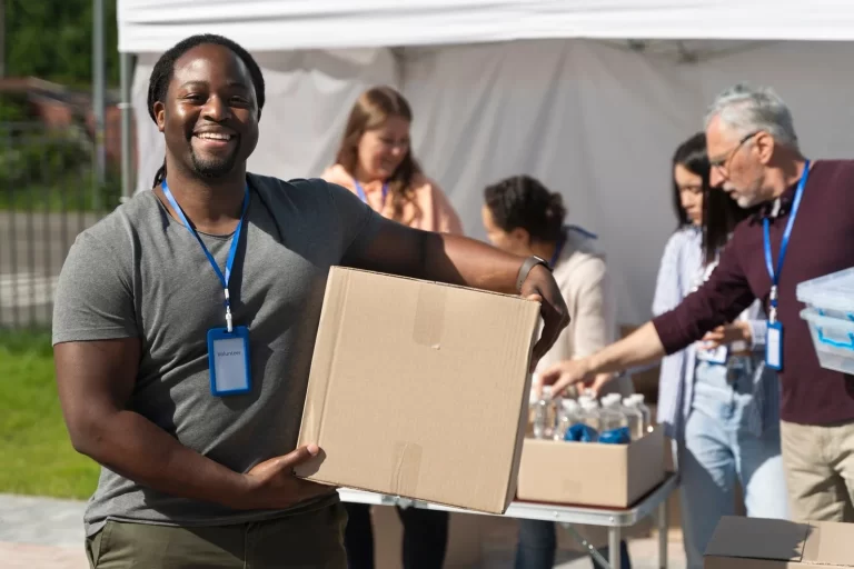 different-people-doing-volunteer-work-with-food_23-2149012176